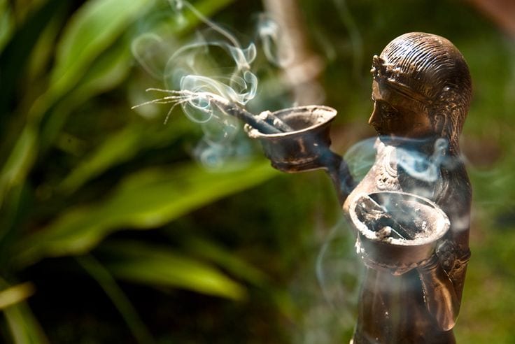 Statue holding incense
