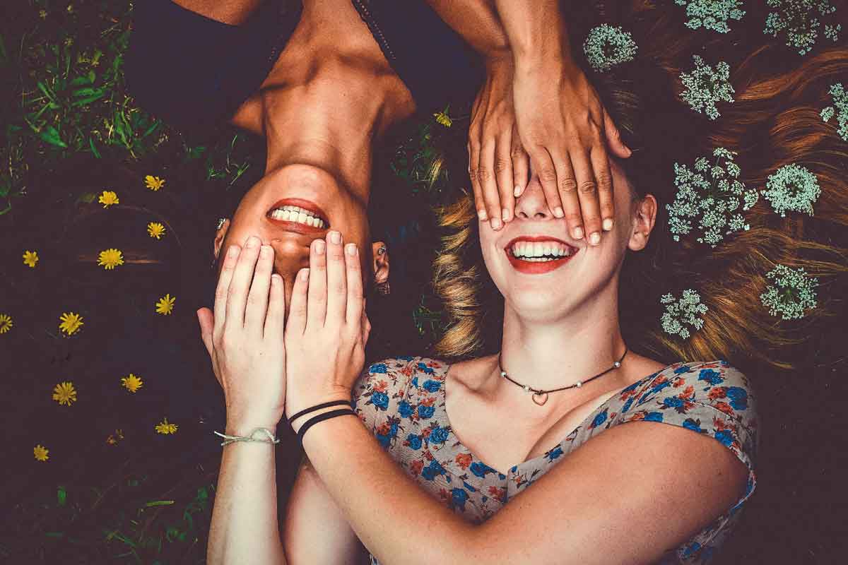 two woman laying side by side