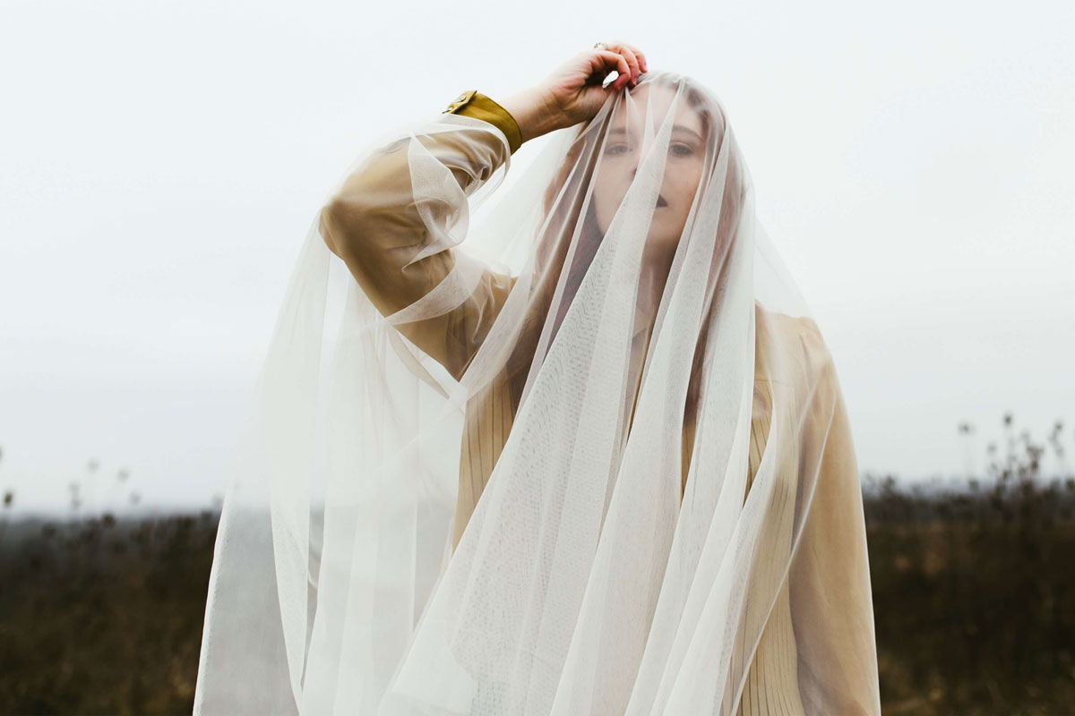 woman with a white veil over her head
