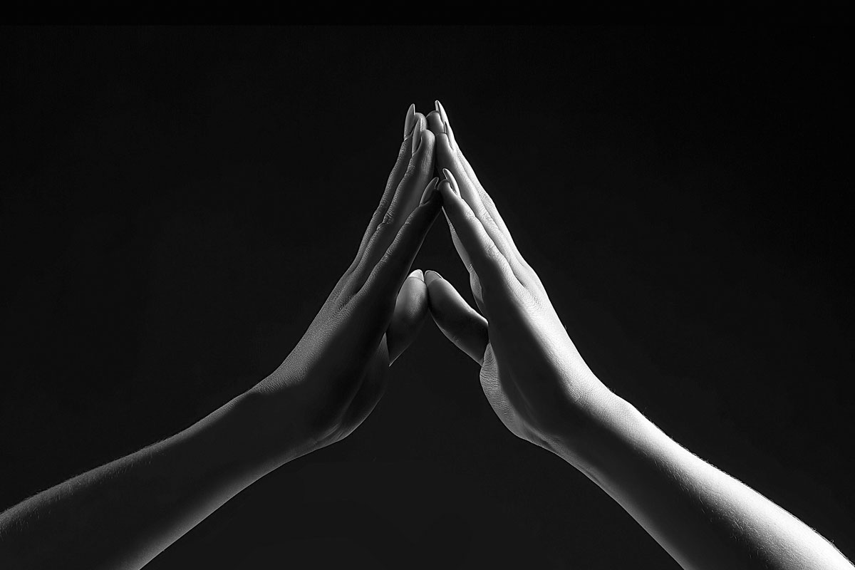 two hands touching each other