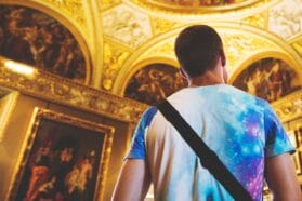 man looking at a cathedral ceiling