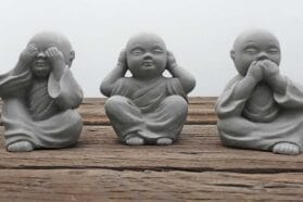 three happy buddha statues