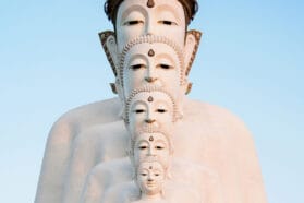 multiple buddha heads stacked