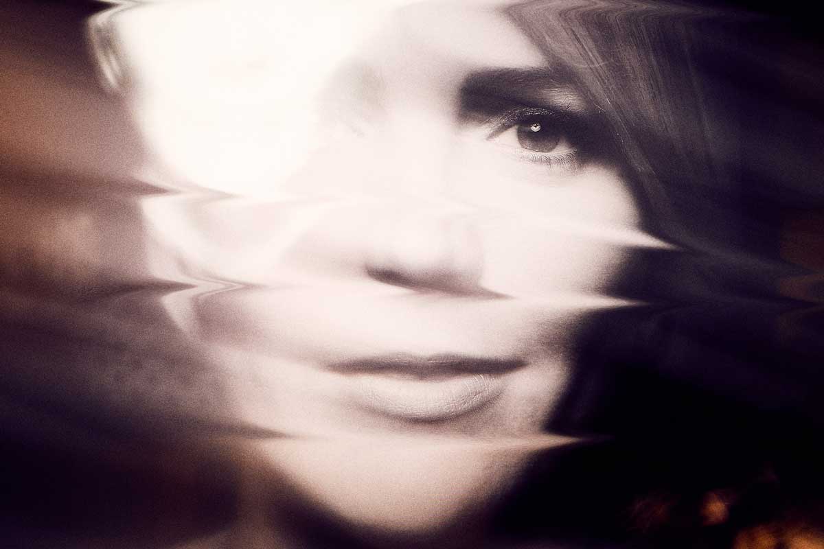 woman with a blurred face
