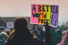 Woman holding a protest sign