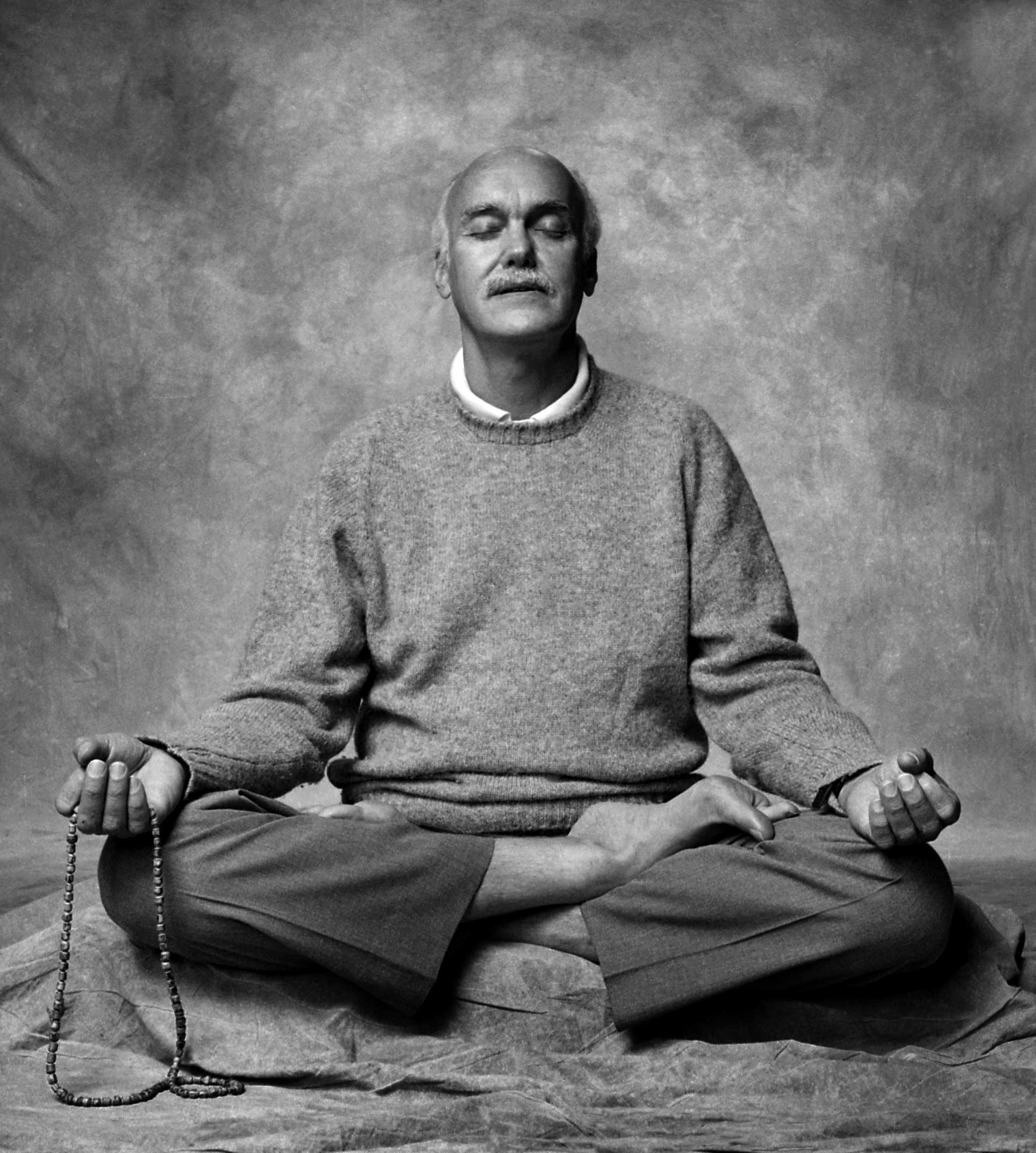 Ram Dass Sitting in Meditation with Mala